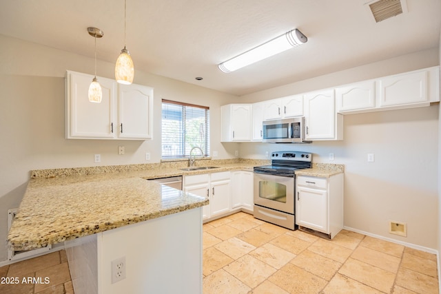17824 E Chestnut Dr, Queen Creek, AZ 85142 - kitchen featuring stainless steel appliances, a peninsula, a sink, visible vents, and light stone counters