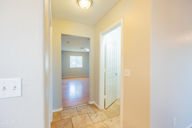 17824 E Chestnut Dr, Queen Creek, AZ 85142 - hall featuring baseboards and stone tile floors
