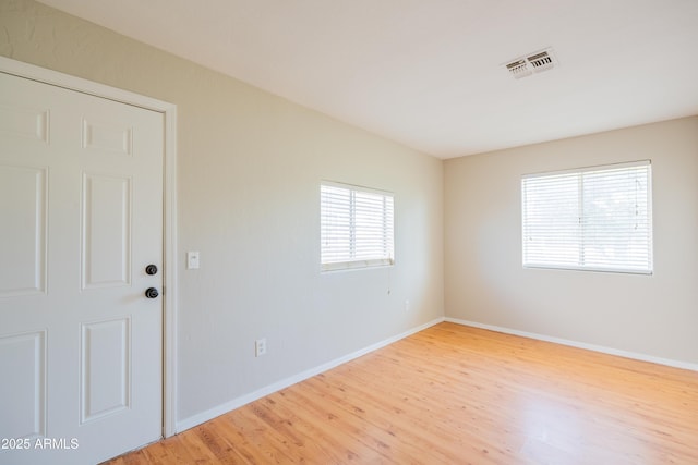 17824 E Chestnut Dr, Queen Creek, AZ 85142 - spare room featuring wood finished floors, visible vents, and baseboards