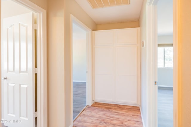 17824 E Chestnut Dr, Queen Creek, AZ 85142 - hall with light wood finished floors, baseboards, and visible vents