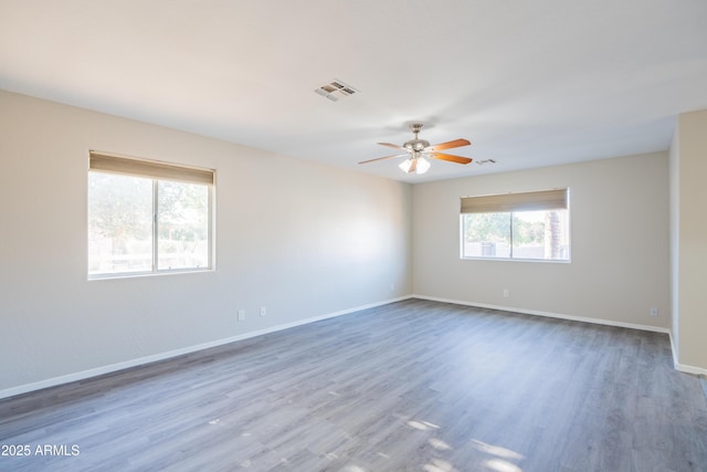 17824 E Chestnut Dr, Queen Creek, AZ 85142 - unfurnished room with wood finished floors, visible vents, baseboards, and ceiling fan