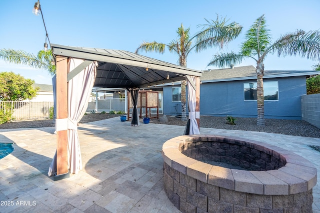 17824 E Chestnut Dr, Queen Creek, AZ 85142 - view of patio / terrace with a fire pit, a gazebo, and a fenced backyard