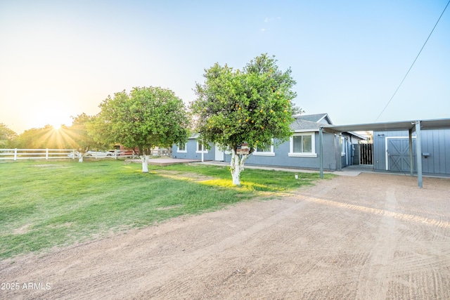 17824 E Chestnut Dr, Queen Creek, AZ 85142 - view of front of house with fence, a carport, dirt driveway, and a front yard