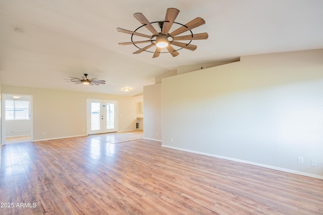 17824 E Chestnut Dr, Queen Creek, AZ 85142 - empty room featuring lofted ceiling, a wealth of natural light, light wood-type flooring, and ceiling fan