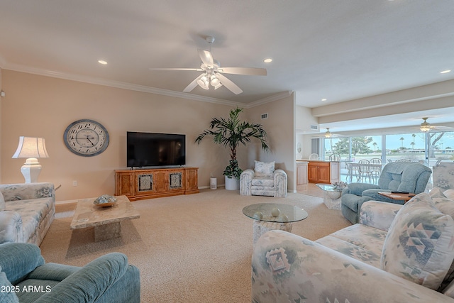 carpeted living room featuring ornamental molding and ceiling fan