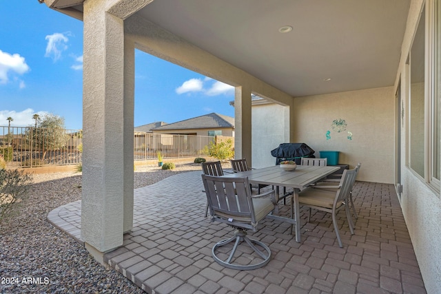 view of patio featuring outdoor dining space and a fenced backyard