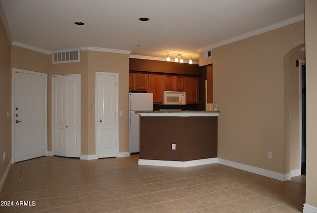 kitchen featuring white appliances, light tile patterned floors, and ornamental molding