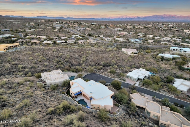 aerial view at dusk with a mountain view