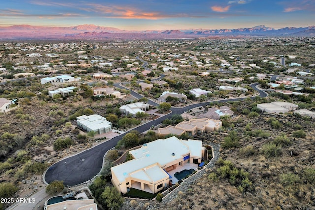 aerial view at dusk with a mountain view