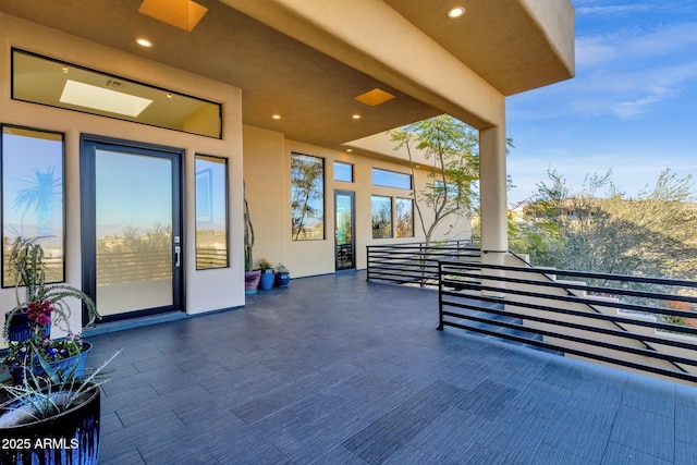 view of patio with a balcony