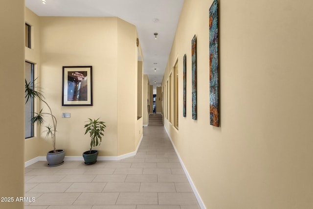 hall featuring light tile patterned flooring