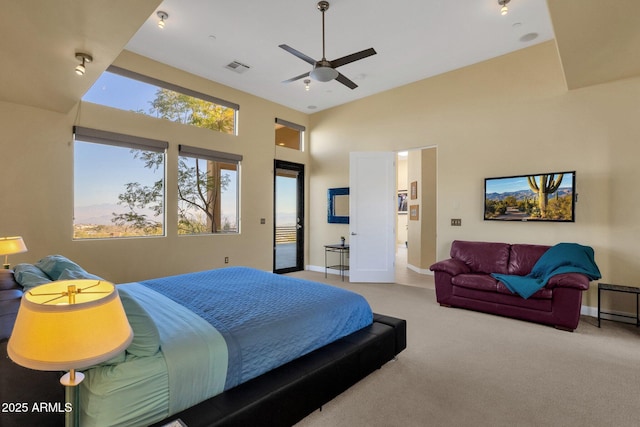 bedroom featuring carpet flooring, ceiling fan, and high vaulted ceiling