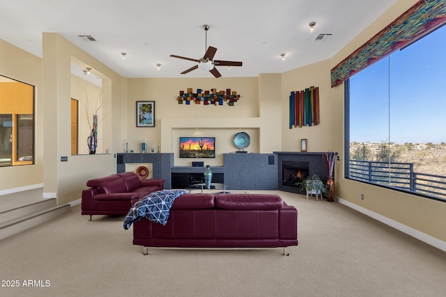 living room with light carpet and ceiling fan