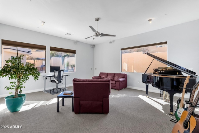 carpeted living room featuring ceiling fan