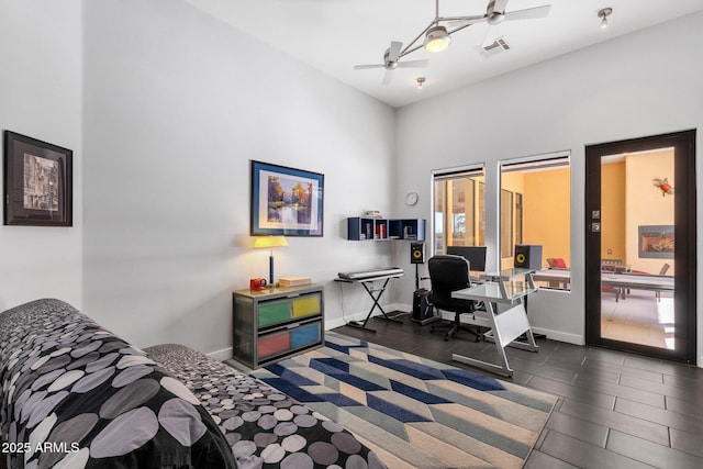 office featuring ceiling fan and high vaulted ceiling