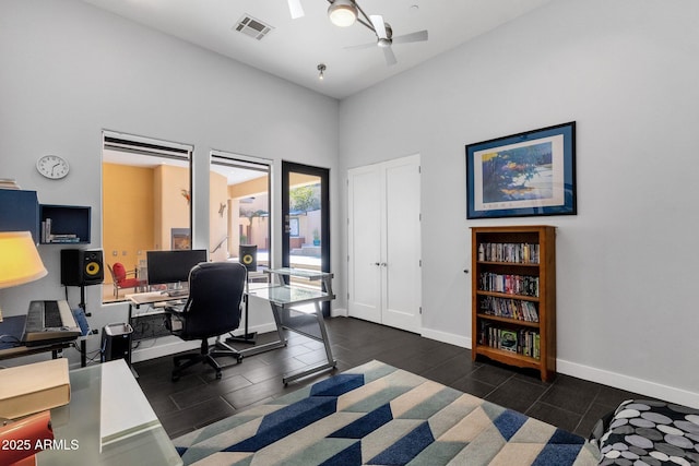 home office with ceiling fan and high vaulted ceiling