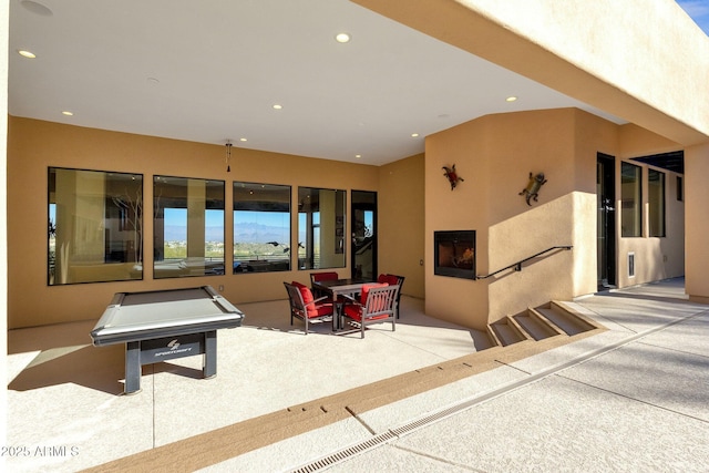 recreation room featuring a fireplace and billiards