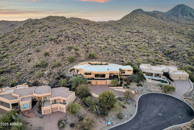 aerial view at dusk with a mountain view