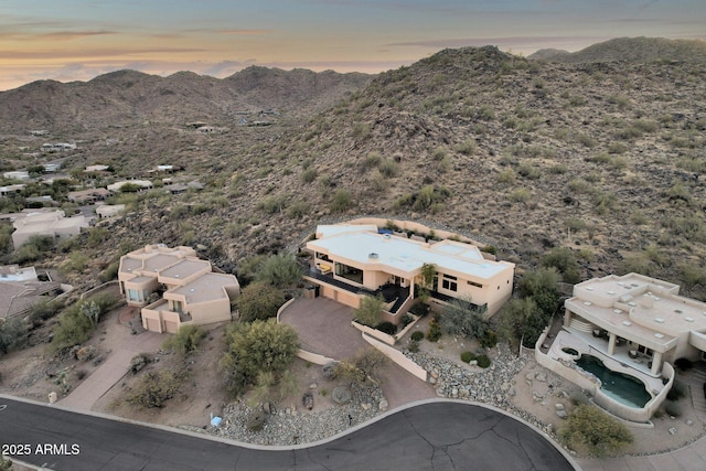 aerial view at dusk with a mountain view