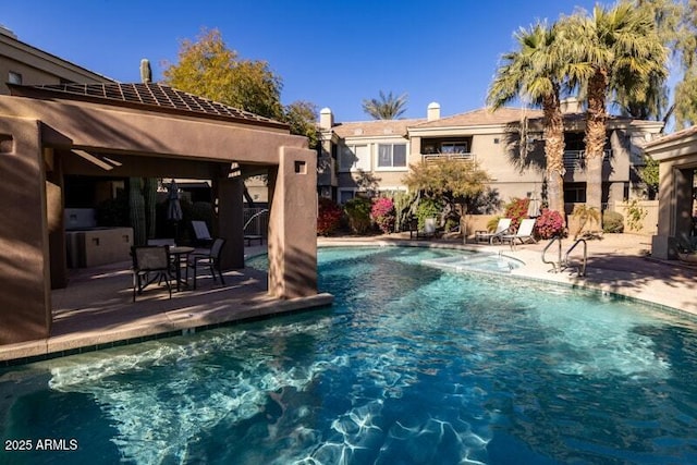 view of swimming pool featuring a patio