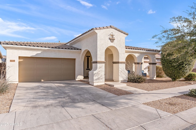 mediterranean / spanish house featuring a garage