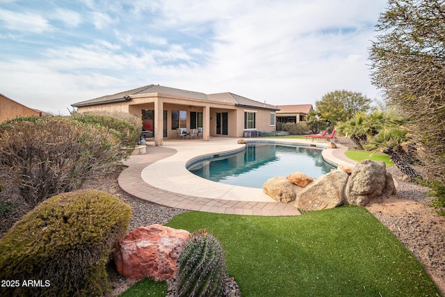 view of swimming pool featuring a patio