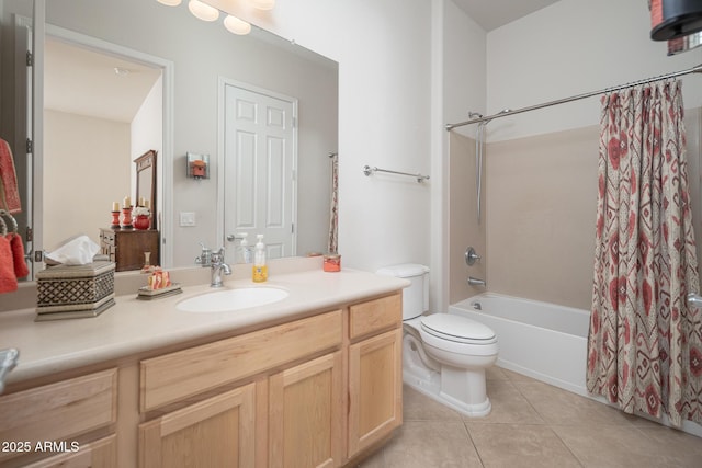 full bathroom with shower / bath combo with shower curtain, tile patterned floors, toilet, and vanity