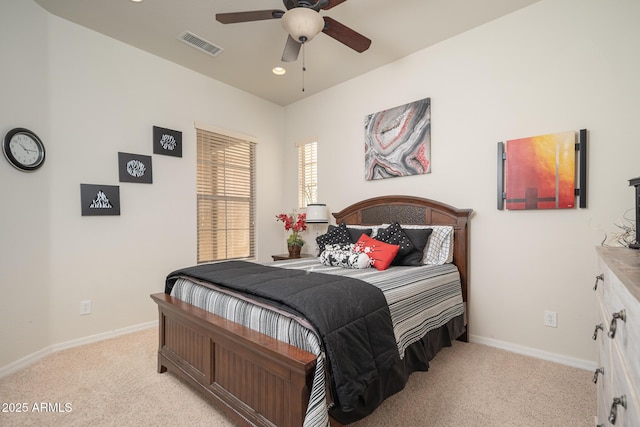 bedroom featuring light colored carpet and ceiling fan