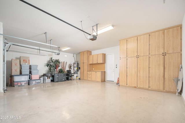 garage with a garage door opener and water heater