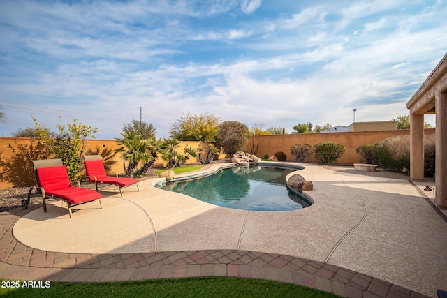 view of swimming pool featuring a patio area