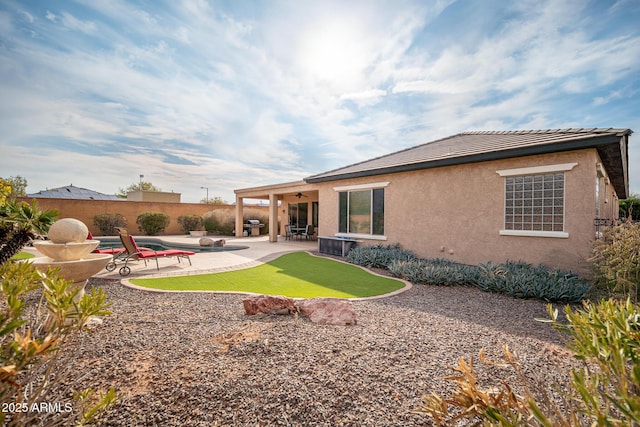 back of property featuring a patio