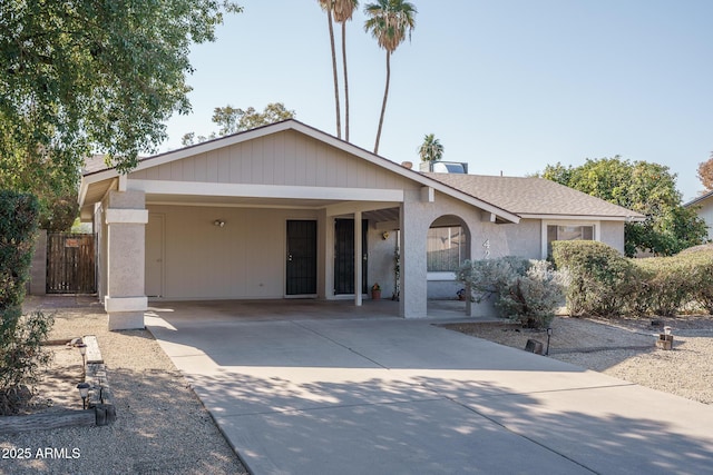 ranch-style home with a carport