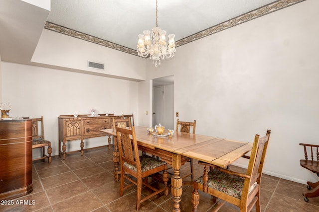 11109 W Granada Dr, Sun City, AZ 85373 - dining room featuring baseboards, visible vents, a notable chandelier, and dark tile patterned floors