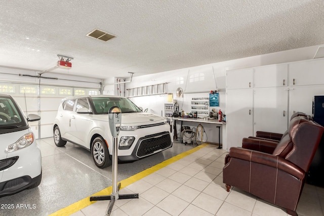 11109 W Granada Dr, Sun City, AZ 85373 - garage with visible vents and a garage door opener