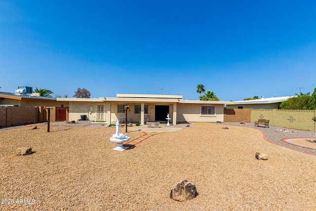 11109 W Granada Dr, Sun City, AZ 85373 - back of house featuring a patio area and fence