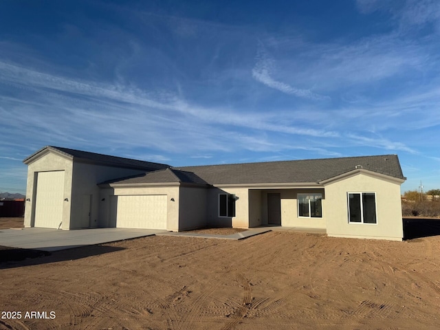 single story home featuring a garage