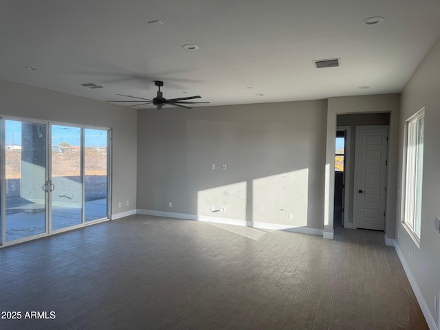 unfurnished room with wood-type flooring and ceiling fan