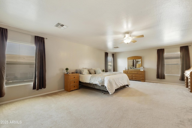 bedroom with light colored carpet and ceiling fan