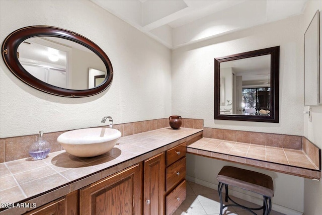 bathroom featuring tile patterned flooring and vanity