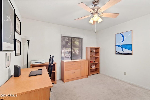 office space with ceiling fan and light colored carpet