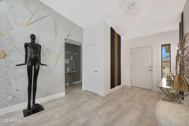 foyer entrance with wood finished floors