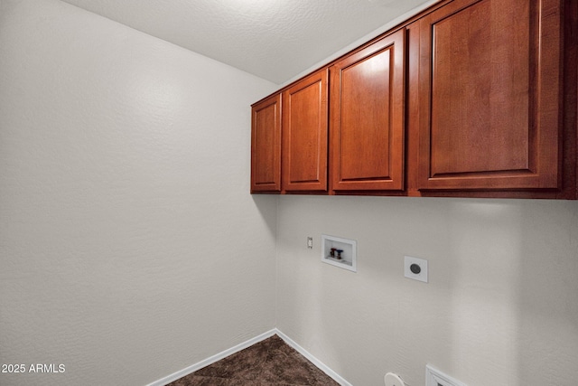laundry area featuring gas dryer hookup, electric dryer hookup, cabinet space, baseboards, and hookup for a washing machine