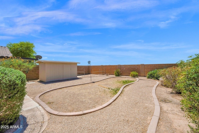 view of yard with an outdoor structure and a fenced backyard