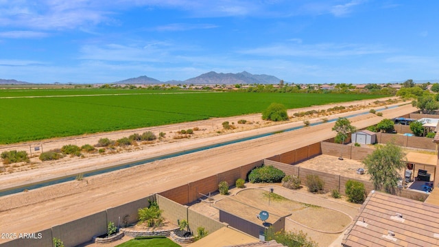 birds eye view of property with a mountain view and a rural view