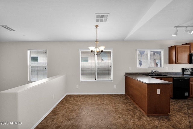 kitchen featuring a sink, dark countertops, visible vents, and dishwasher