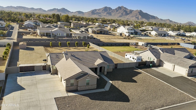 birds eye view of property with a mountain view