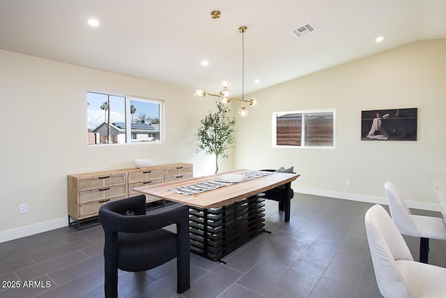 dining room featuring vaulted ceiling and an inviting chandelier