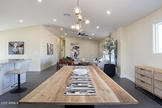 dining space with ceiling fan and vaulted ceiling