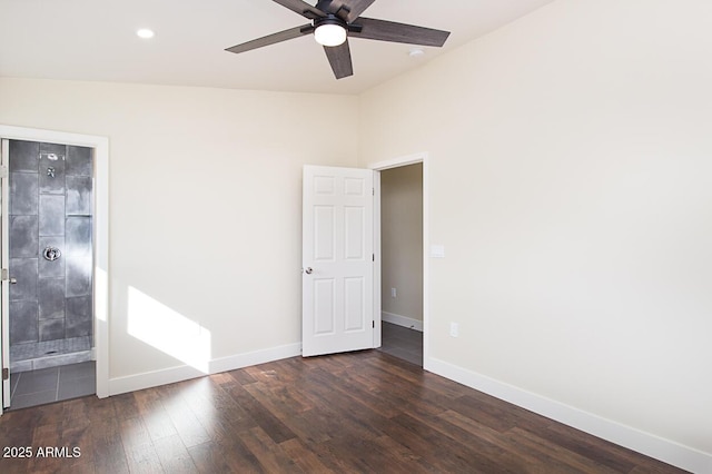 unfurnished room featuring vaulted ceiling, dark hardwood / wood-style floors, and ceiling fan