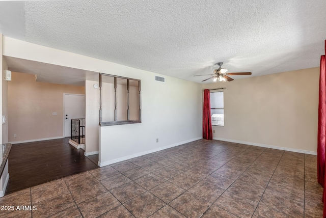 4114 E Muirwood Dr, Phoenix, AZ 85048 - empty room with ceiling fan, a textured ceiling, and baseboards